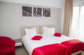 Фото номера Стандартный двухместный номер с 2 отдельными кроватями Отель Potaissa Hotel г. Турда 5